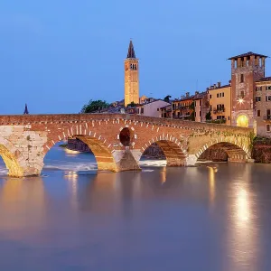 Ponte Pietra and Basilica of Saint Anastasia bell tower at dusk from from Ponte Pietra. Verona, Veneto, Italy Ponte Pietra and Basilica of Saint Anastasia bell tower at dusk from from Ponte Pietra. Verona, Veneto, Italy