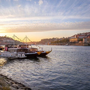 Port wine boats moored on the south bank of Douro River, Porto, Portugal