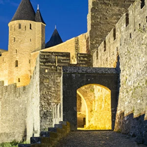 Porte d Aude city gates entrance to medieval citadel of La Cite at night