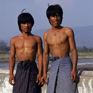 Portrait of local village men showing their elaborate tattoos