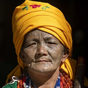 Portrait of a woman with traditional tattooed face in Mindat, Chin State, Myanmar