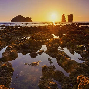 Portugal, Azores, Sao Miguel, Mosteiros, Sunset over the rocks Ilheus dos Mosteiros