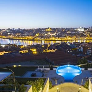 Portugal, Douro Litoral, Porto. Dusk view towards the old town of Porto and the Ribeira