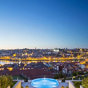 Portugal, Douro Litoral, Porto. Dusk view towards the old town of Porto and the Ribeira