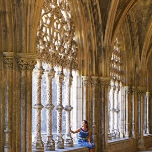 Portugal, Estremadura, Batalha, Monastery of Santa Maria da Vitoria; Woman sitting
