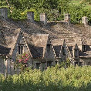 Pretty cottages at Arlington Row in the Cotswolds village of Bibury, Gloucestershire, England