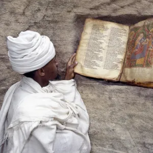 A Priest of the Ethiopian Orthodox Church reads a very old