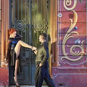 Professional Tango Dancers with "Filieteado Art"in the background, Jean Jaures street, Abasto, Buenos Aires, Argentina. (MR)