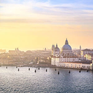 Punta della Dogana during sunset as seen from St George island. Venice, Veneto, Italy