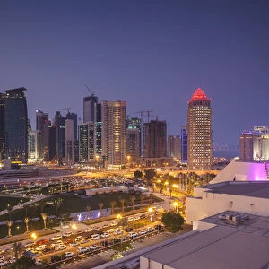 Qatar, Doha, Doha Bay, West Bay Skyscrapers, elevated view, dusk