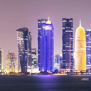 Qatar, Doha. Skyline with skyscrapers, at night from the Corniche