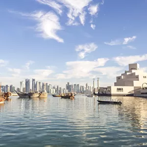 Qatar, Doha. View of the harbour with the city in the background and the museum of