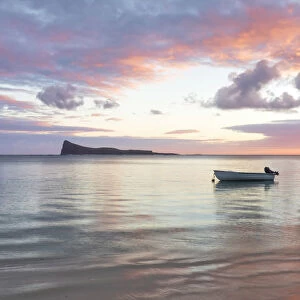 the quiet of a colorful sunrise at the beach, Pamplemousses district, Mauritius, Africa