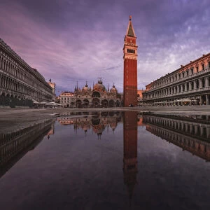 rain puddle reflectio at St. Mark Square, Venice, Italy