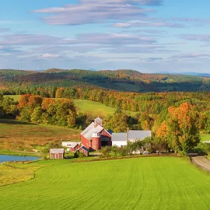 Red barn in hills and valley in autumn, Barnet, Vermont, USA Red barn in hills and valley in autumn, Barnet, Vermont, USA