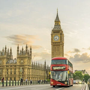 A red bus on Westminster Bridege and Big Ben, also known as Elizabeth Tower. Part of the Houses of Parliament and a Unesco World Heritage site, London, England, UK