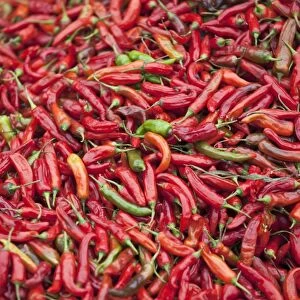 Red chillies for sale at Paro open-air market. Both red and green chillies are very important ingredients for Bhutanese food. The most popular Bhutanese dish is ema datsi a hot dish of green chillies cooked in cheese