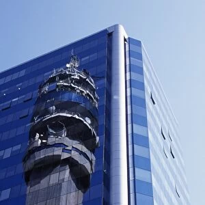 Reflection of the Entel Communications Tower in an office building