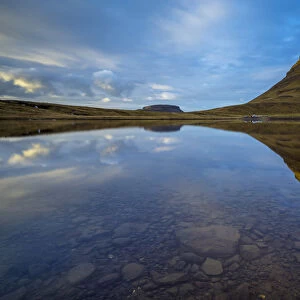 Reflection of Kirkjufell mountain in still water, Snaefellsness Peninsula, Western