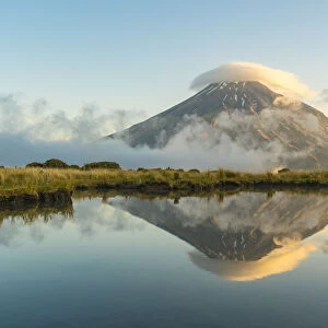 Reflection of Mount Taranaki before sunset. Egmont National Park, New Plymouth district