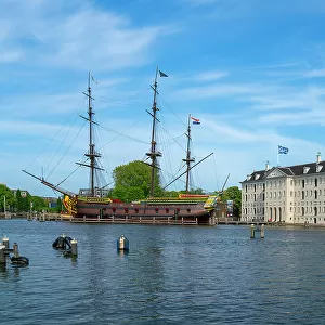 Replica of The Amsterdam moored in Amstel river and National Maritime Museum, Community Marineterrein, Amsterdam, Netherlands