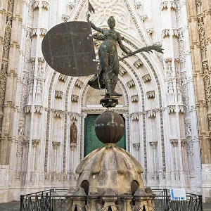 Replica of the Giraldillo statue that symbolizes Christian Faith, Hope and Victory at the entrance to Catedral de Santa Maria de la Sede (Cathedral of Seville), Seville, Andalusia, Spain