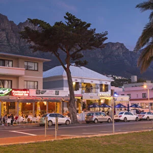 Restaurants in Camps Bay at dusk, Cape Town, Western Cape, South Africa