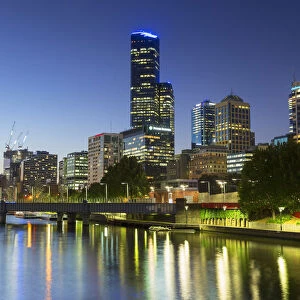 Rialto Towers and skyline along Yarra River at dusk, Melbourne, Victoria, Australia