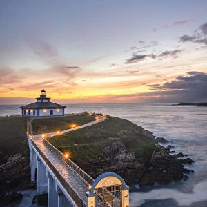 Ribadeo, Province of Lugo, Galicia, Spain. Illa Pancha lighthouse at dusk