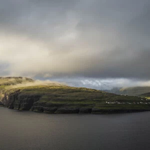 Rising and Kellingin sea stacks and the village of Eiði. Eysturoy, Faroe Islands