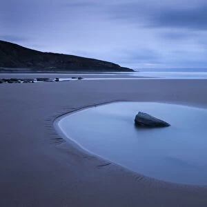 Rockpool on the sandy Southerndown beach at dawn, Dunraven Bay, Glamorgan Heritage Coast