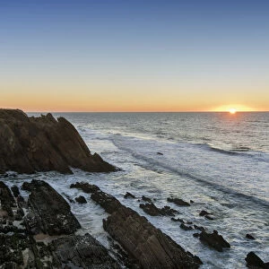 The rocky coast of Sao Pedro de Moel at sunset. Marinha Grande, Leiria. Portugal