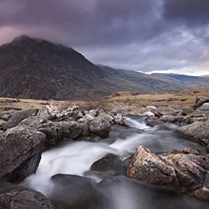 Rocky river flowing through mountains, Snowdonia, Wales, UK. Spring