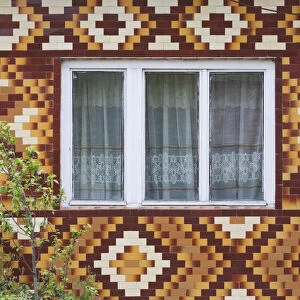 Romania, Transylvania, Viile Tecii, house detail with tile pattern