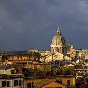 Rome, Italy; A narrowed overview of rooftops with the St. Peters Basilica Cupola on the horizon
