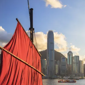 Sail of junk boat and skyline of Hong Kong Island, Hong Kong