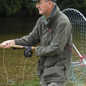 A salmon fisherman fly fishing the Oak Tree Pool on