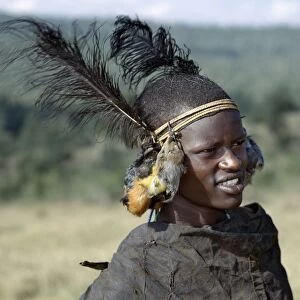 A Samburu initiate with bird skins hanging from his headband