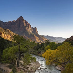 Scenic view of The Watchman mountain from Virgin river at sunset, Zion National Park