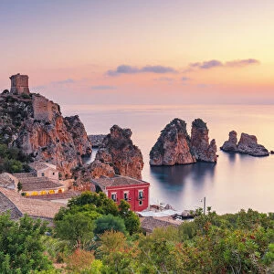 Scopello, Sicily. Elevated view of the tonnara and the sea stacks at dawn
