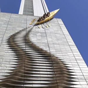 A sculpture of a canoe climbing a highrise building in Central Osaka, Osaka, Kansai