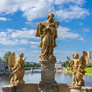 Sculptures on Pisek Stone Bridge which is the oldest stone bridge in the Czech Republic, Pisek, South Bohemian Region, Czech Republic