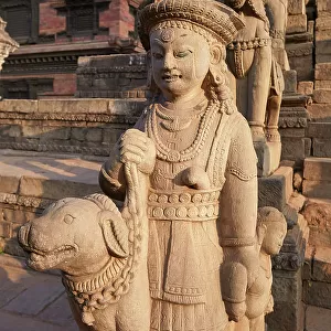 Sculptures in a temple of the Durbar Square of Bhaktapur at sunset, Kathmandu Valley, Nepal