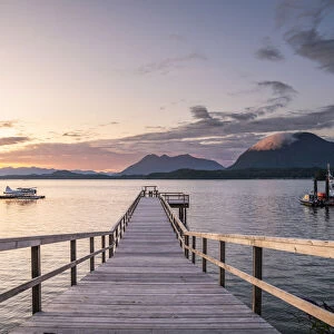 Seaplanes and dock at sunset in Tofino, Vancouver Island, British Columbia, Canada