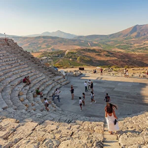 Segesta, Sicily. Tourists visiting the theater of Segesta at sunset