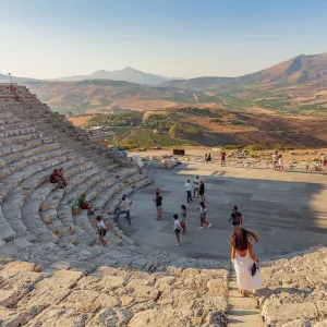 Segesta, Sicily. Tourists visiting the theater of Segesta at sunset