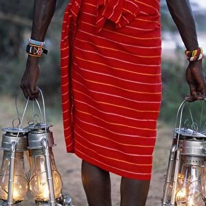 Service in the bush - kerosene lanterns light the pathway