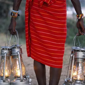 Service in the bush - kerosene lanterns light the pathway