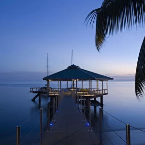 Seychelles, Praslin Island, Anse Bois de Rose, pier at the Coco de Mer hotel, sunset