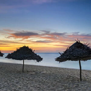 Shade umbrellas on Puka Shell Beach at sunset, Boracay Island, Aklan Province, Western